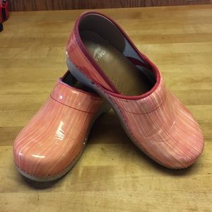 Orange and pink Dansko clogs